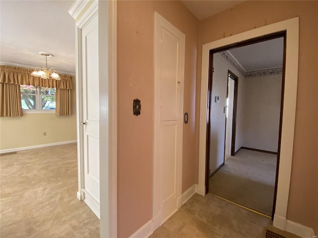 hallway with a notable chandelier