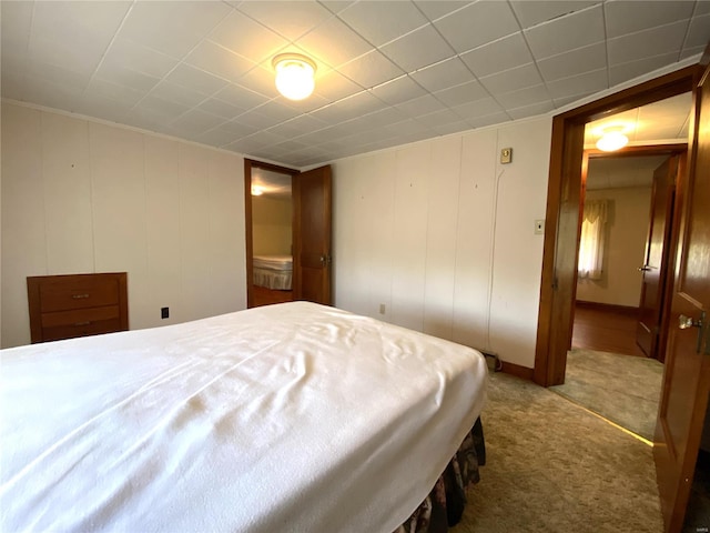 bedroom with dark colored carpet