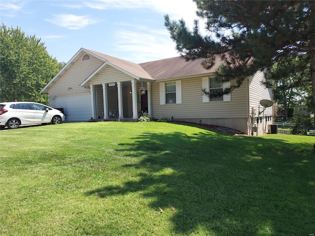 ranch-style home featuring a front yard and a garage