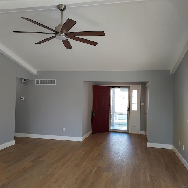 entrance foyer featuring wood-type flooring, vaulted ceiling with beams, and ceiling fan