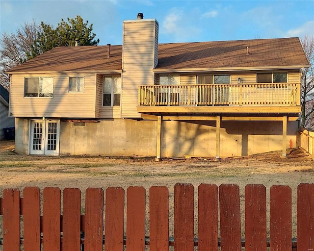 rear view of house featuring a deck