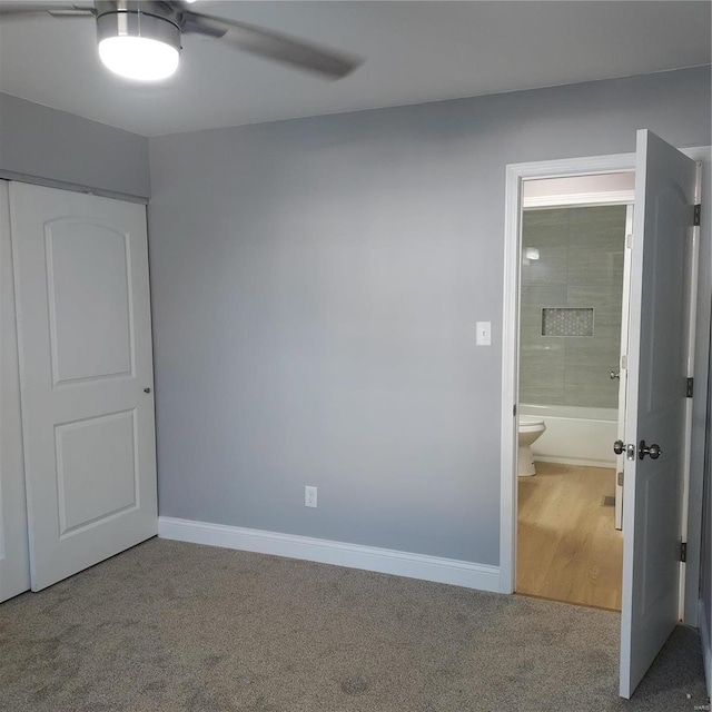 unfurnished bedroom with carpet and ceiling fan