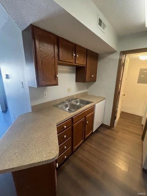 kitchen with sink, a textured ceiling, dishwasher, and dark hardwood / wood-style floors