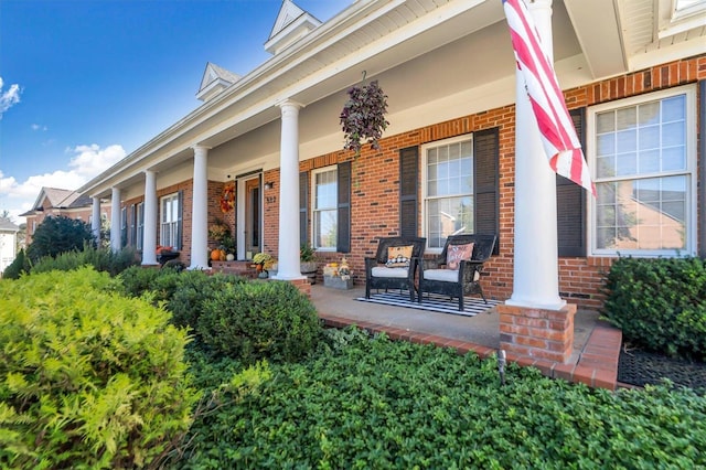 view of exterior entry with covered porch