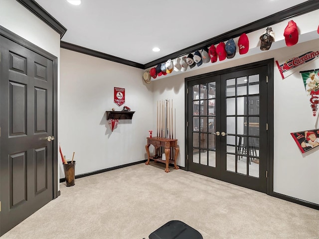 interior space featuring french doors, light carpet, and ornamental molding