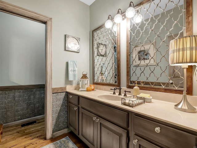 bathroom featuring vanity and hardwood / wood-style flooring