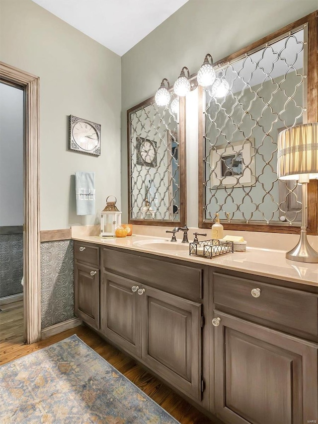 bathroom with vanity and hardwood / wood-style floors