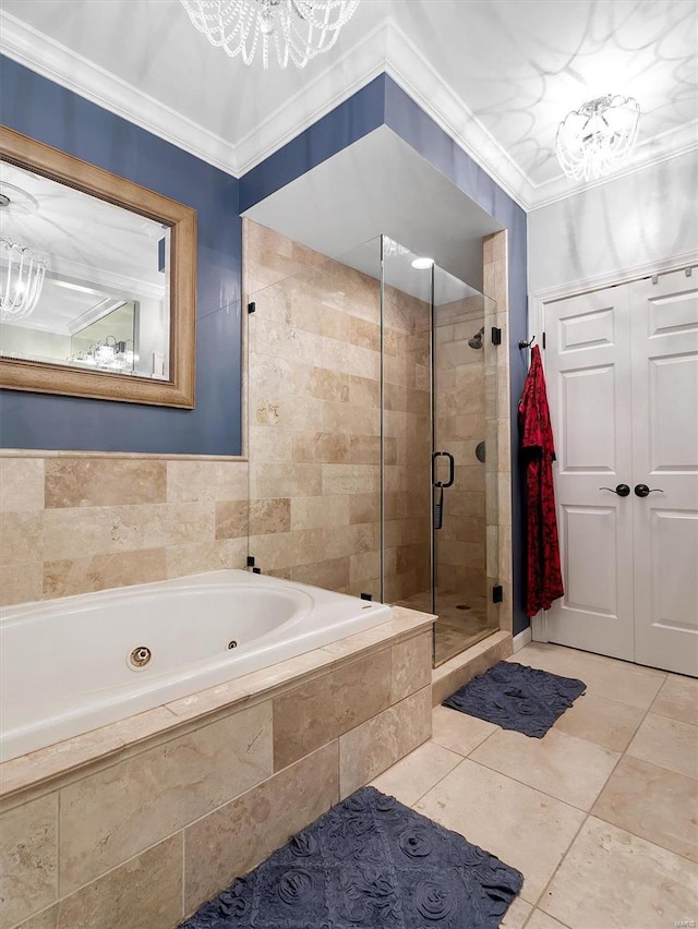 bathroom featuring tile patterned floors, ornamental molding, and separate shower and tub