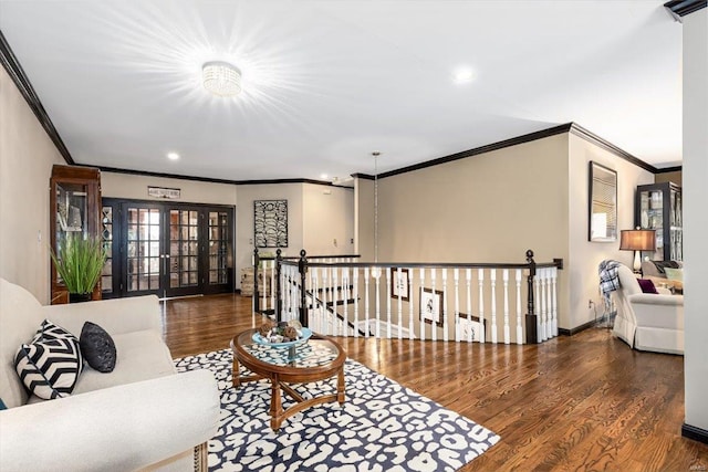 living room with french doors, ornamental molding, and dark hardwood / wood-style flooring