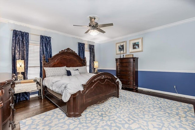 bedroom featuring dark wood-type flooring, crown molding, and multiple windows