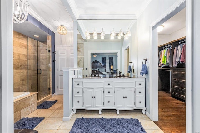 bathroom featuring crown molding, vanity, independent shower and bath, and tile patterned flooring