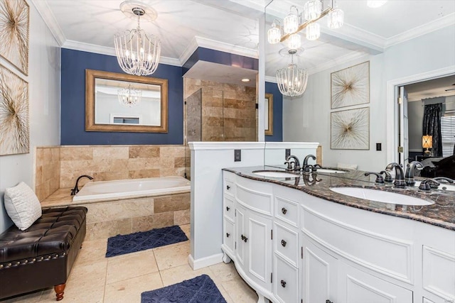 bathroom with an inviting chandelier, vanity, and crown molding