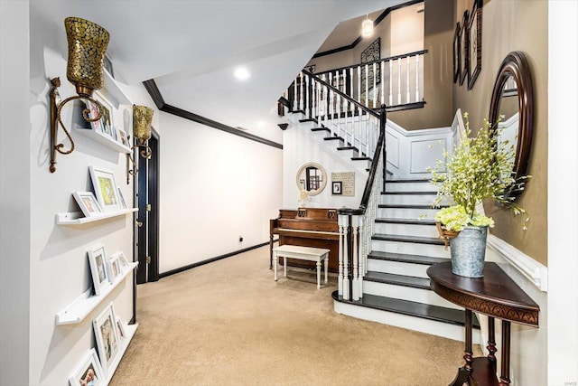 interior space with a towering ceiling and ornamental molding