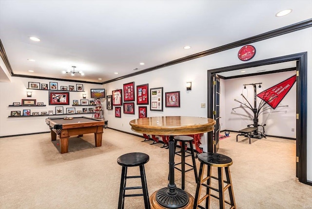 recreation room with billiards, ornamental molding, and light carpet