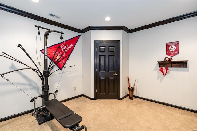 workout area featuring light carpet and ornamental molding