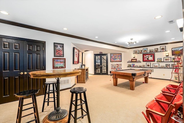 rec room featuring crown molding, light carpet, and french doors