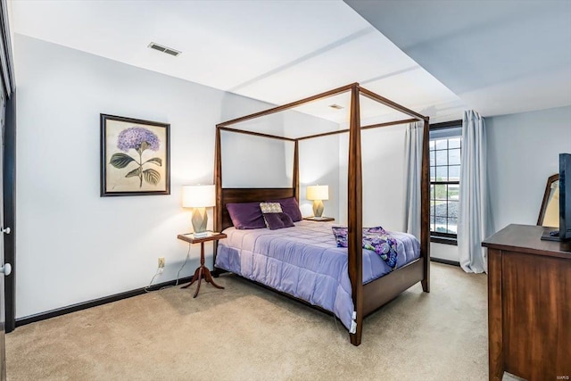 bedroom with light colored carpet