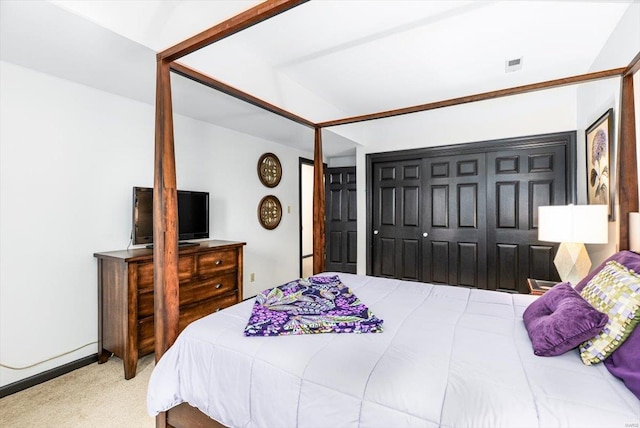 carpeted bedroom with a closet