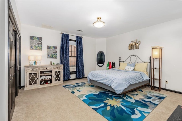 bedroom with light carpet