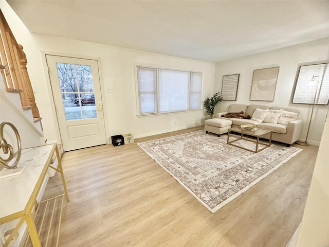 living room with light hardwood / wood-style flooring