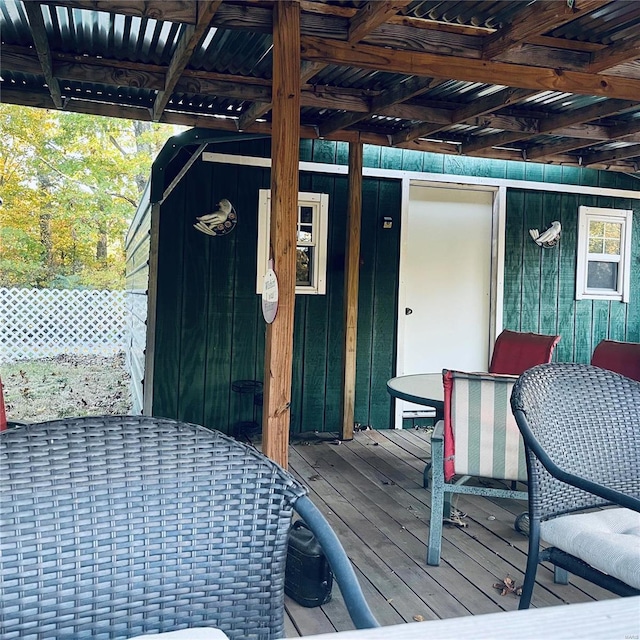 deck featuring a storage shed