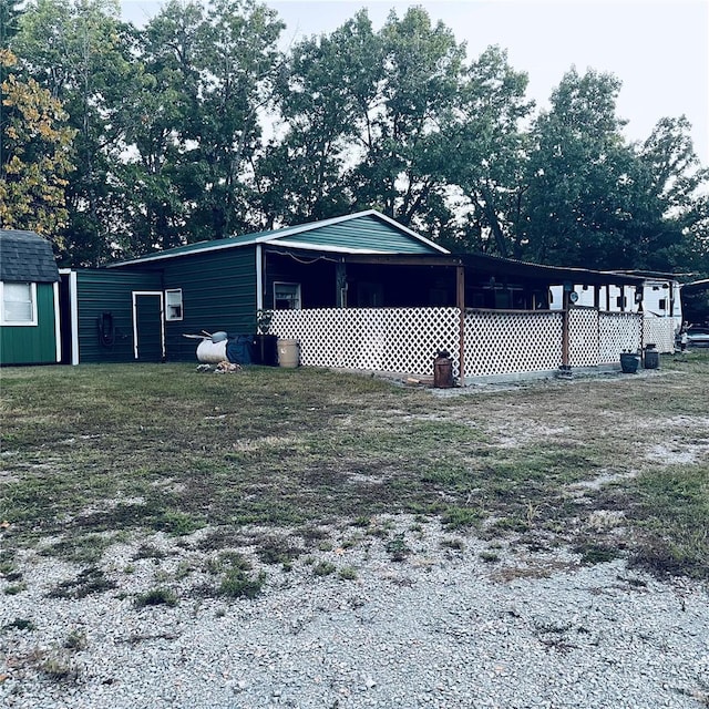 view of home's exterior with an outdoor structure