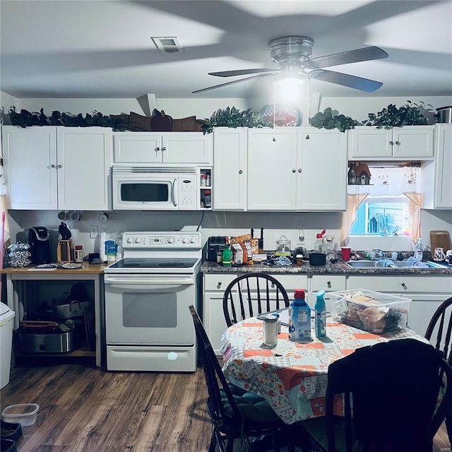 kitchen with white cabinetry, dark hardwood / wood-style floors, white appliances, and ceiling fan