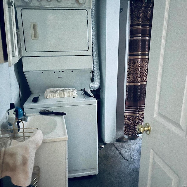 laundry room with stacked washer and dryer and dark carpet