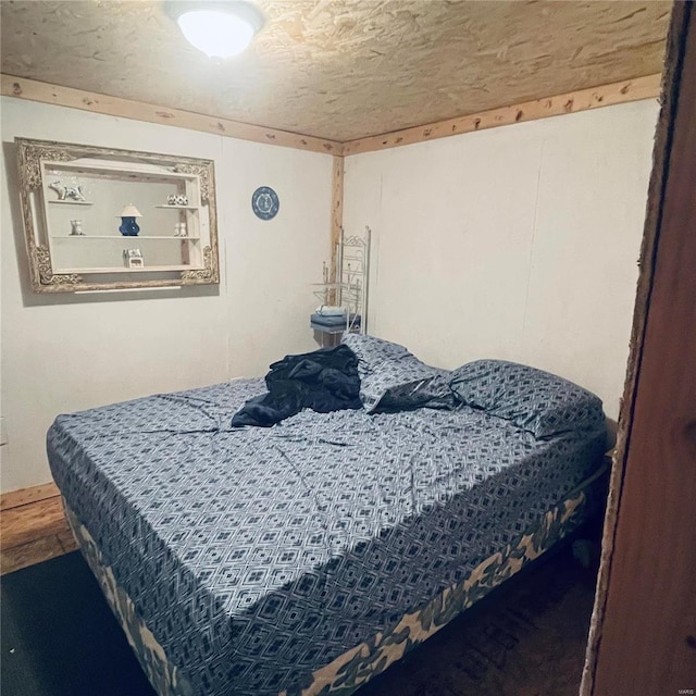 bedroom featuring a textured ceiling