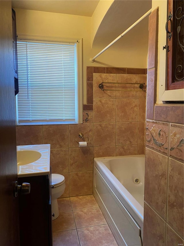 full bathroom featuring shower / bathtub combination, vanity, tile walls, tile patterned flooring, and toilet