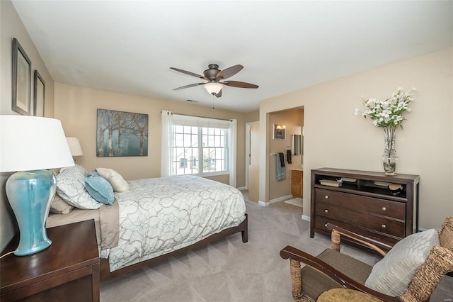 bedroom featuring ceiling fan and light carpet