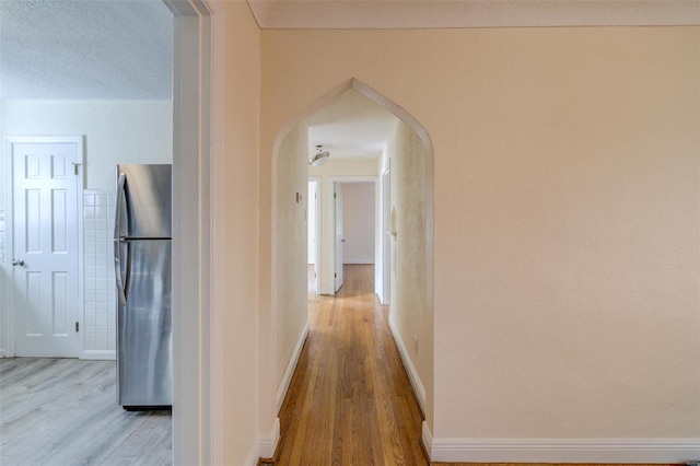 corridor featuring light hardwood / wood-style floors