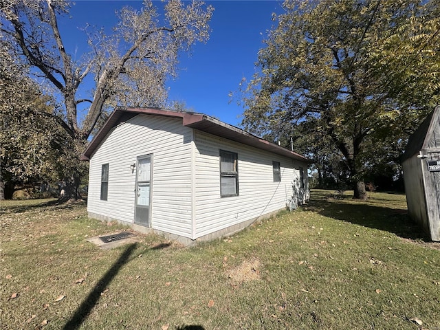 view of home's exterior featuring a lawn