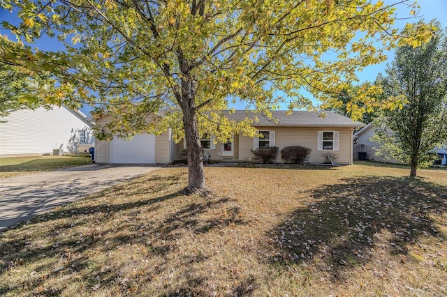 ranch-style house featuring a front yard and a garage