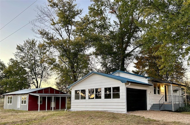 view of front of house with a yard and a garage