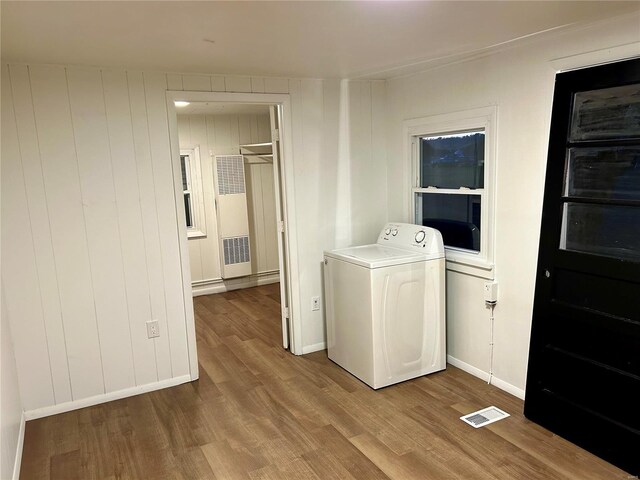 laundry area with washer / clothes dryer and hardwood / wood-style flooring