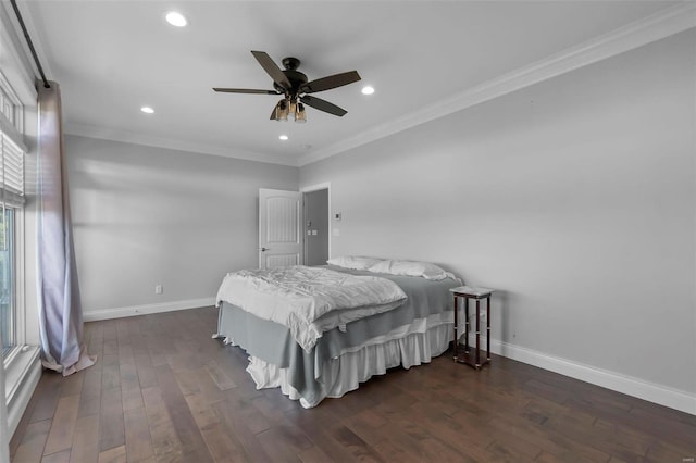 bedroom featuring dark hardwood / wood-style flooring, ornamental molding, and ceiling fan