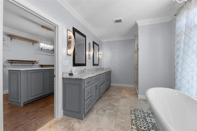 bathroom with vanity, crown molding, hardwood / wood-style floors, and independent shower and bath