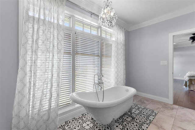 bathroom with crown molding, a tub to relax in, ceiling fan with notable chandelier, and tile patterned flooring