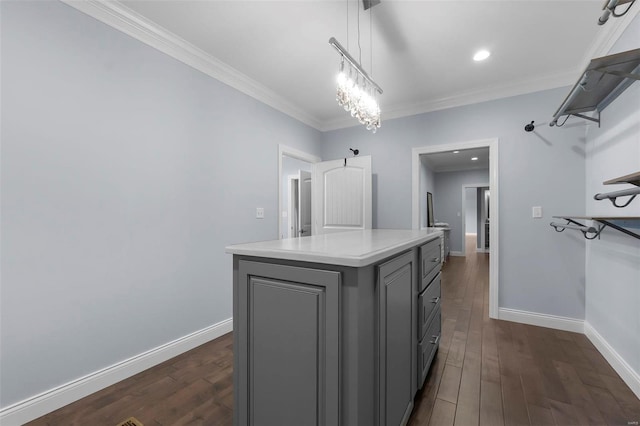 walk in closet featuring a notable chandelier and dark hardwood / wood-style floors