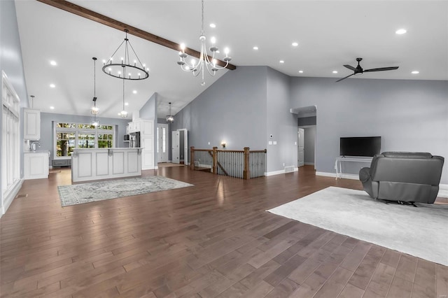 living room featuring ceiling fan with notable chandelier, dark hardwood / wood-style floors, and high vaulted ceiling