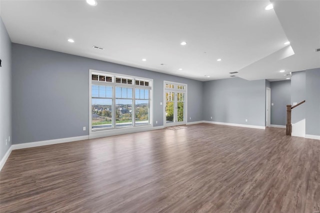 unfurnished living room with hardwood / wood-style floors