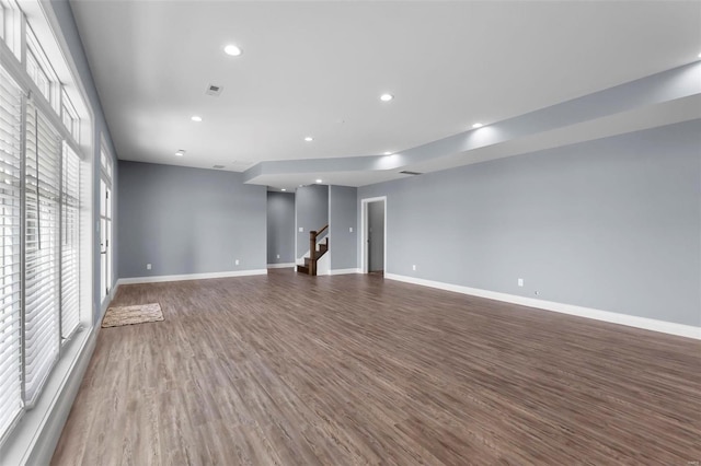 unfurnished living room featuring wood-type flooring