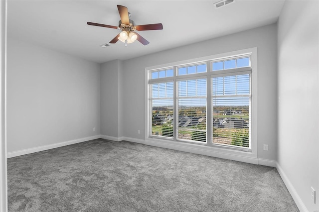 carpeted empty room with ceiling fan