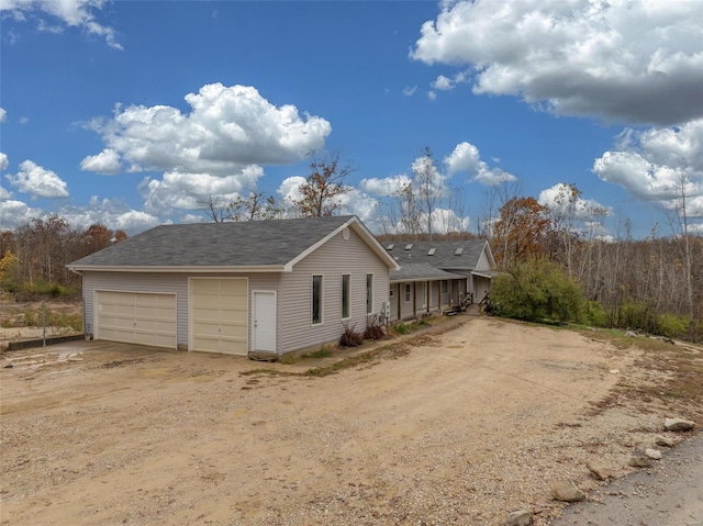 view of side of property featuring a garage