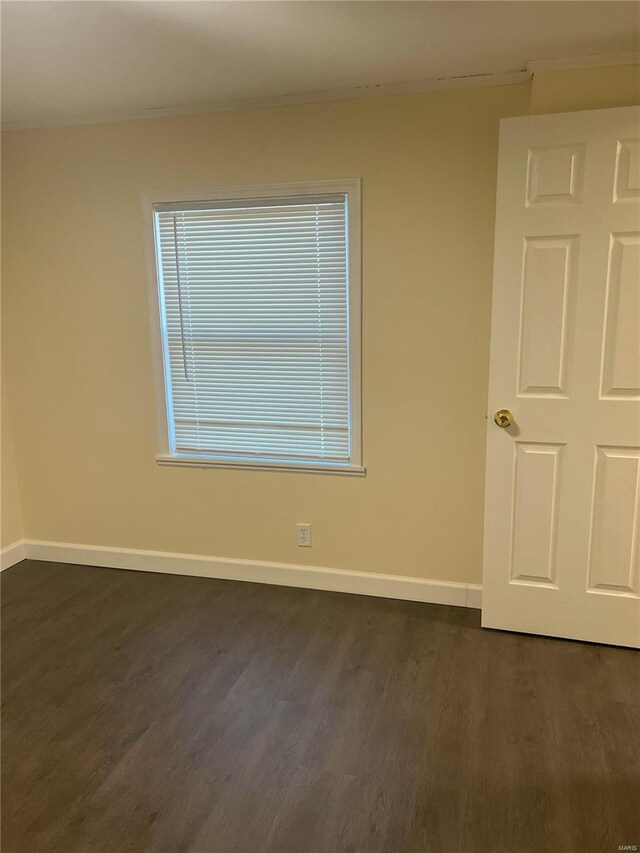 unfurnished room featuring dark hardwood / wood-style floors