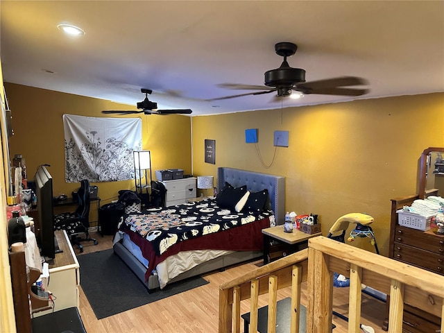 bedroom with wood-type flooring and ceiling fan