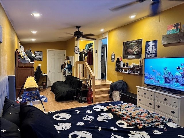 living room with vaulted ceiling, ceiling fan, and light hardwood / wood-style floors