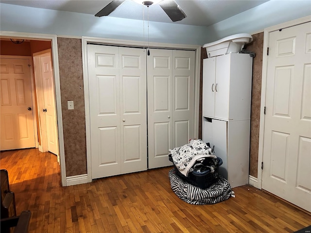 interior space featuring a closet, ceiling fan, and hardwood / wood-style flooring