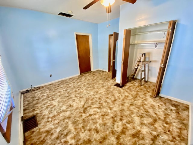 unfurnished bedroom featuring carpet, a closet, and ceiling fan